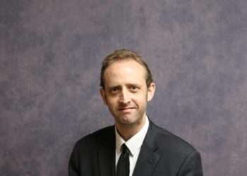 American Mathematician Seeks to Serve England’s Urban Poor