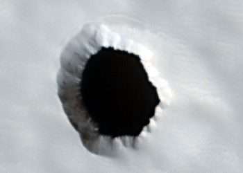 Mystery pitch-black hole 'at least 580ft deep' spotted by Mars probe as scientists share theory on what's hiding inside