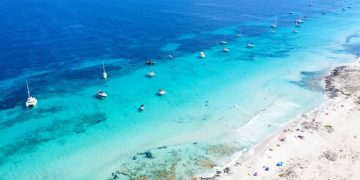 ‘Like the Caribbean’: Ibiza’s quiet little sister with lunar beaches and turquoise oceans 